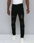 JET BLACK SKINNY JEAN WITH STUDDED BACKED RIPS