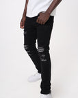 JET BLACK SKINNY JEAN WITH AZTEC PRINT BACKED RIPS AND PEWTER COLOR STARS