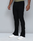 JET BLACK STACKED JEAN WITH FRINGE CUT AND SEW FROM TOP TO BOTTOM