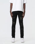 JET BLACK SKINNY JEAN WITH STUDDED BACKED RIPS