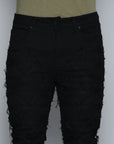 JET BLACK STACKED JEAN WITH FRINGE CUT AND SEW FROM TOP TO BOTTOM