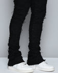 JET BLACK STACKED JEAN WITH FRINGE CUT AND SEW FROM TOP TO BOTTOM