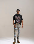DESERT SUN CAMO ALL OVER PATCHWORK STACKED JEAN
