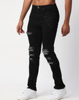 JET BLACK SKINNY JEAN WITH AZTEC PRINT BACKED RIPS AND PEWTER COLOR STARS