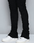JET BLACK STACKED JEAN WITH FRINGE CUT AND SEW FROM TOP TO BOTTOM