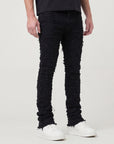 JET BLACK STACKED JEAN WITH FRINGE CUT AND SEW FROM TOP TO BOTTOM