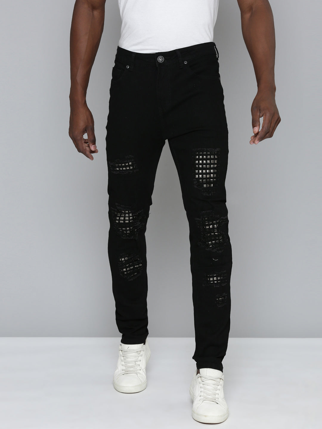 JET BLACK SKINNY JEAN WITH STUDDED BACKED RIPS