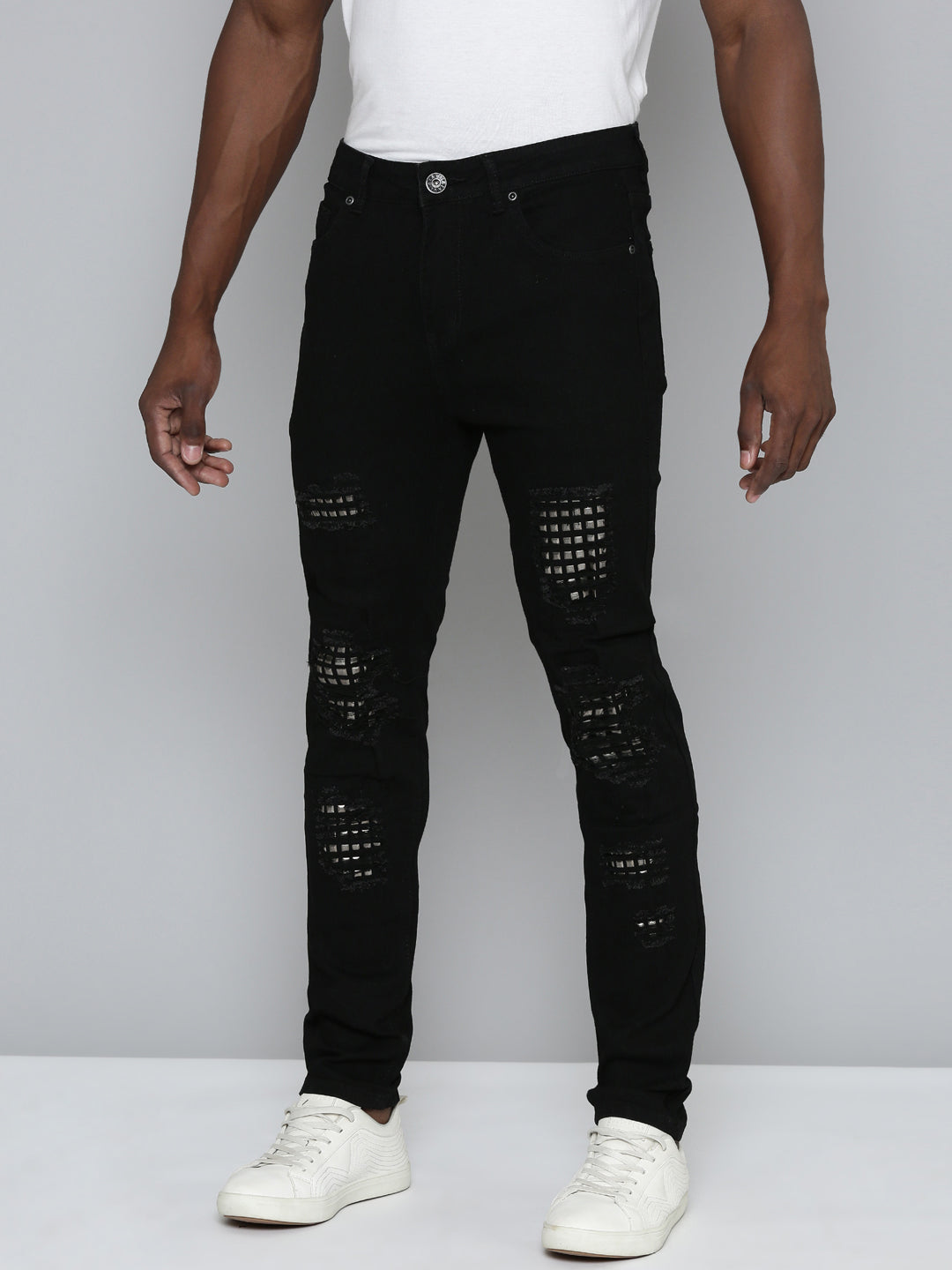 JET BLACK SKINNY JEAN WITH STUDDED BACKED RIPS