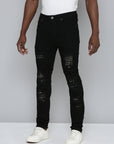 JET BLACK SKINNY JEAN WITH STUDDED BACKED RIPS