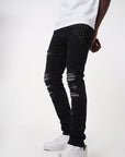 JET BLACK SKINNY JEAN WITH AZTEC PRINT BACKED RIPS AND PEWTER COLOR STARS