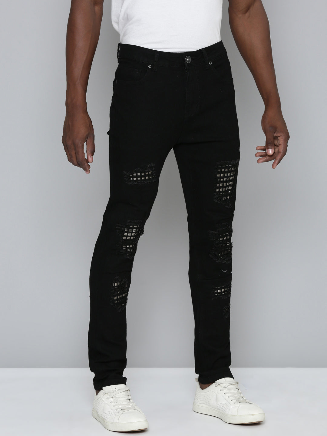 JET BLACK SKINNY JEAN WITH STUDDED BACKED RIPS