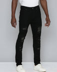 JET BLACK SKINNY JEAN WITH STUDDED BACKED RIPS