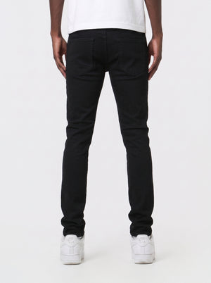 JET BLACK SKINNY JEAN WITH AZTEC PRINT BACKED RIPS AND PEWTER COLOR STARS