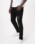 JET BLACK SKINNY JEAN WITH STUDDED BACKED RIPS