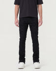 JET BLACK STACKED JEAN WITH FRINGE CUT AND SEW FROM TOP TO BOTTOM