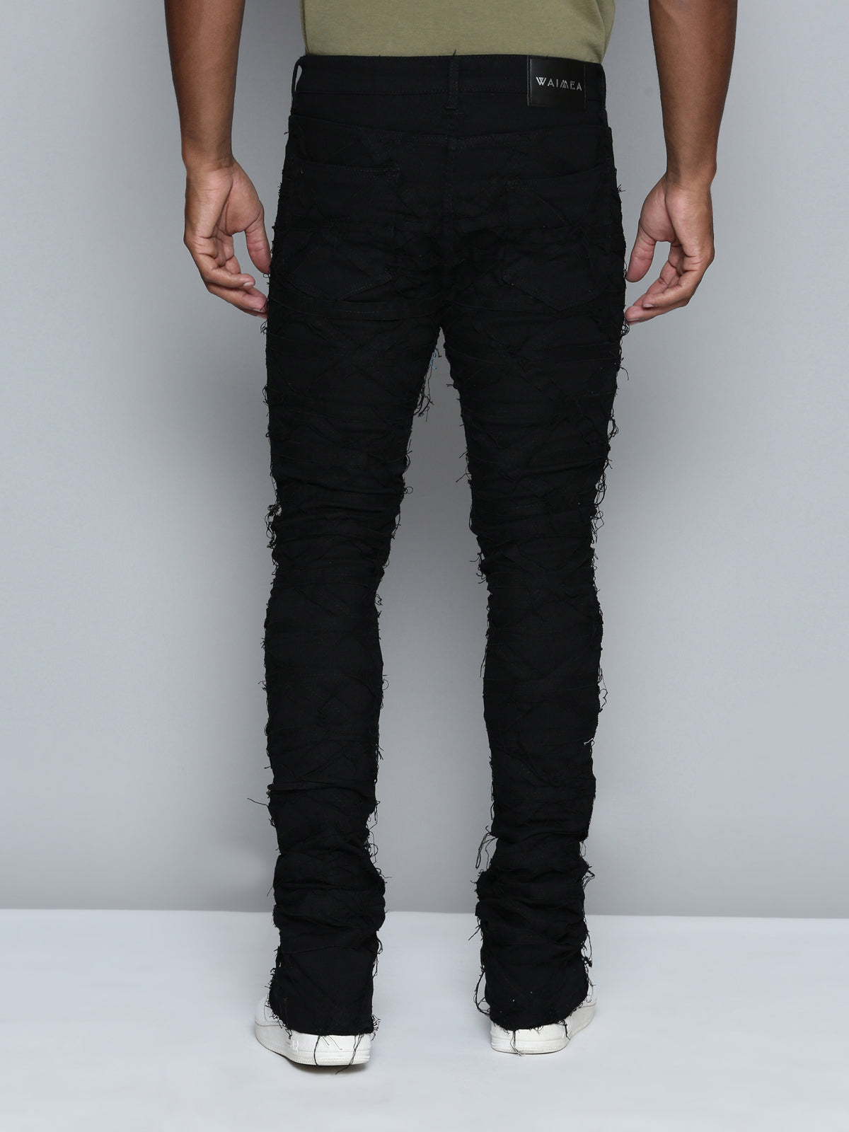 JET BLACK STACKED JEAN WITH FRINGE CUT AND SEW FROM TOP TO BOTTOM