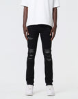 JET BLACK SKINNY JEAN WITH AZTEC PRINT BACKED RIPS AND PEWTER COLOR STARS