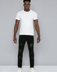 JET BLACK SKINNY JEAN WITH STUDDED BACKED RIPS