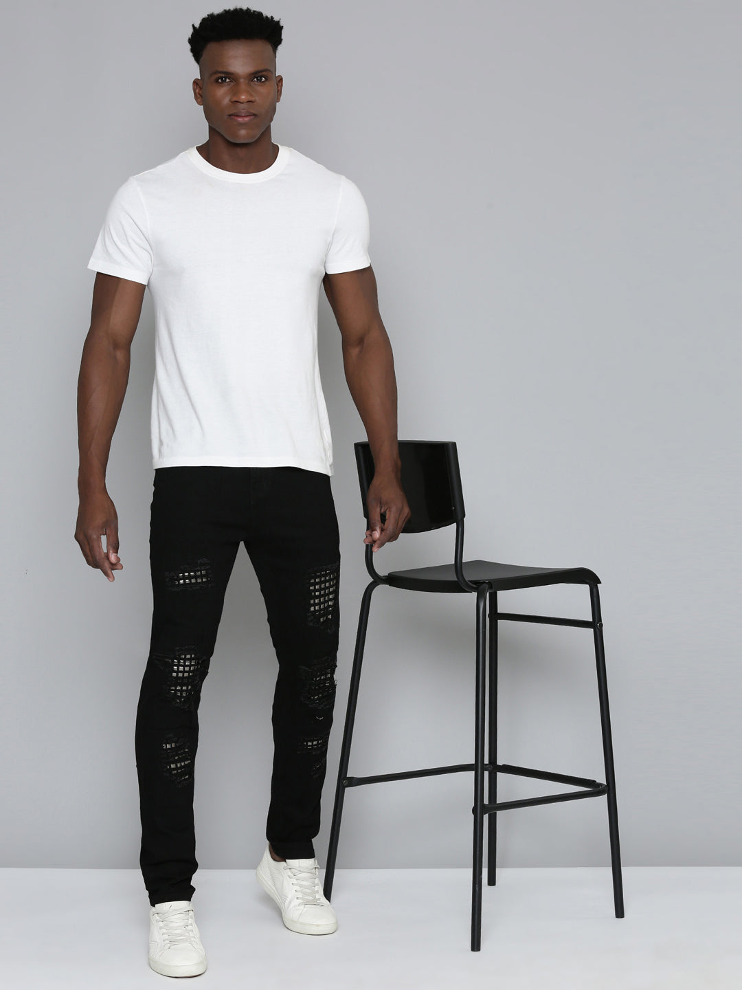 JET BLACK SKINNY JEAN WITH STUDDED BACKED RIPS