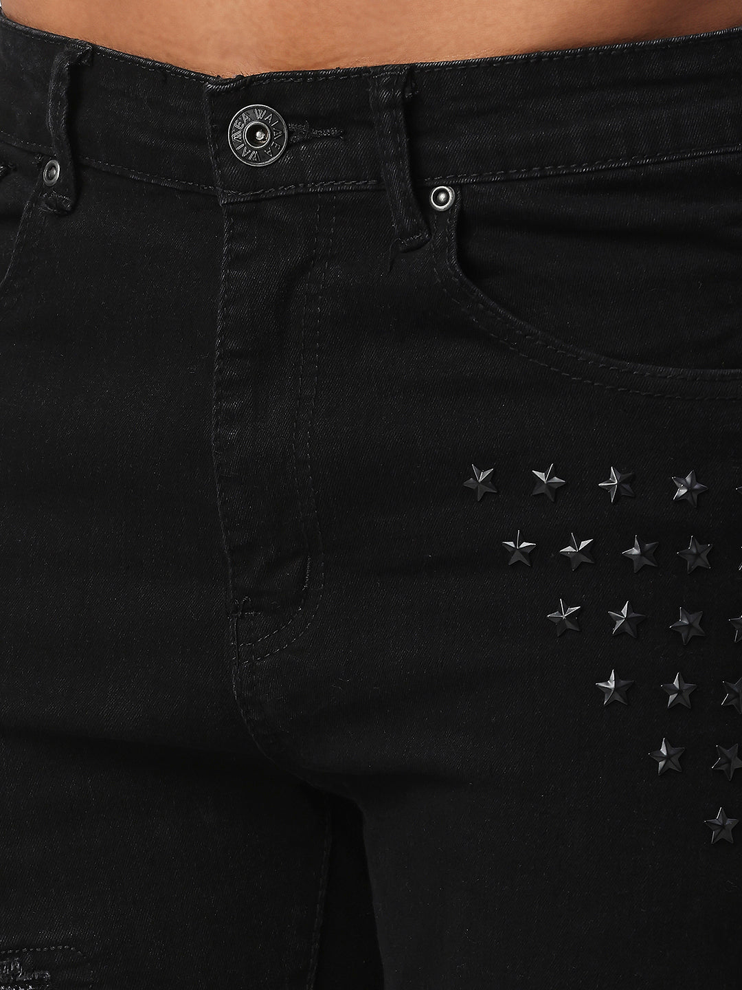 JET BLACK SKINNY JEAN WITH AZTEC PRINT BACKED RIPS AND PEWTER COLOR STARS