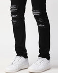 JET BLACK SKINNY JEAN WITH AZTEC PRINT BACKED RIPS AND PEWTER COLOR STARS